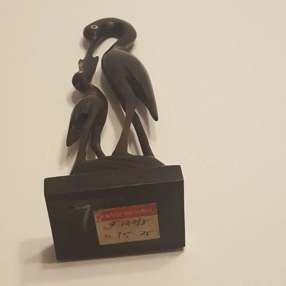 Vintage Stork Bone Figurine feeding a chick. Pre-owned, great shape.